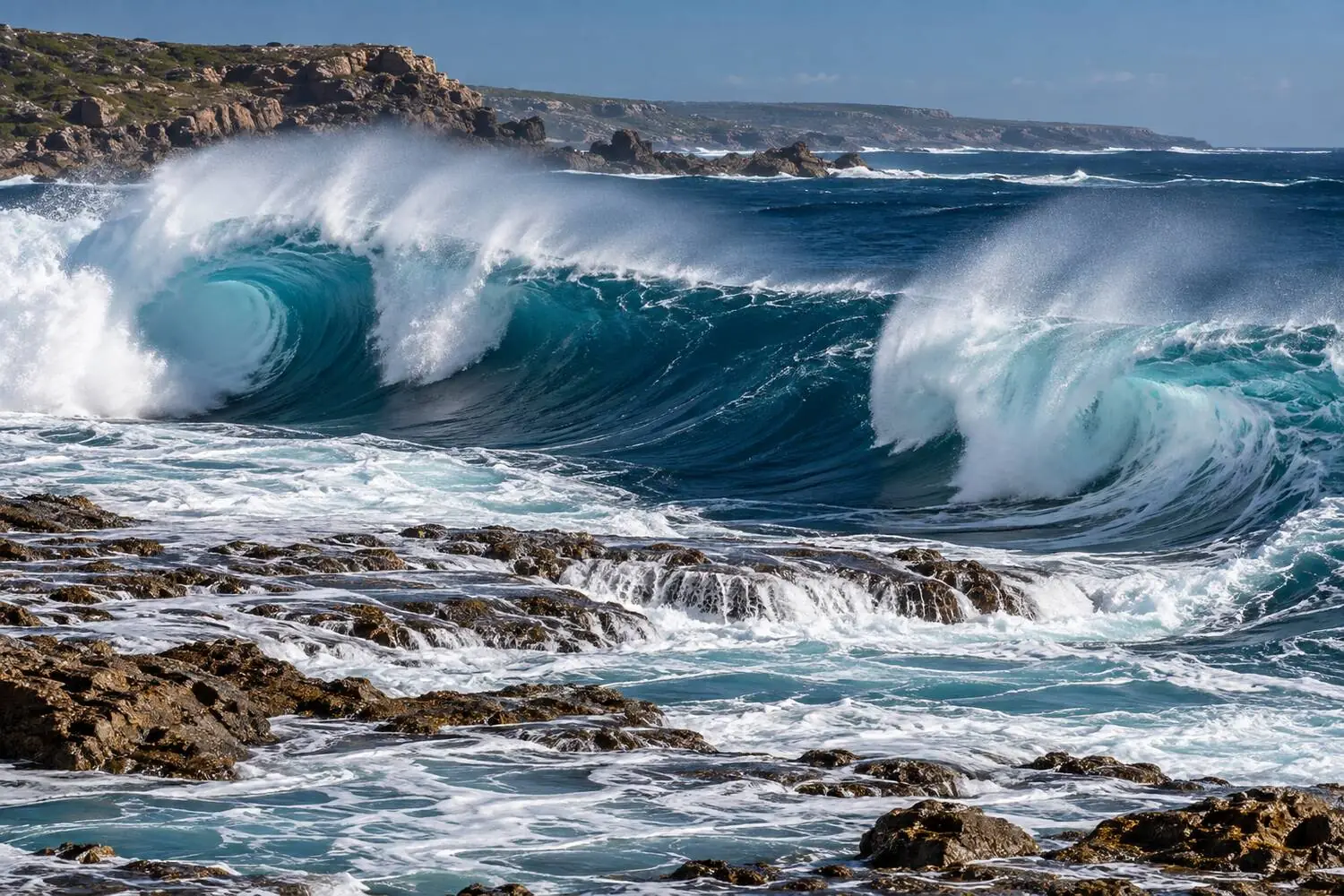 A heavy left and right reef break at Main Break, Margaret River, Western Australia